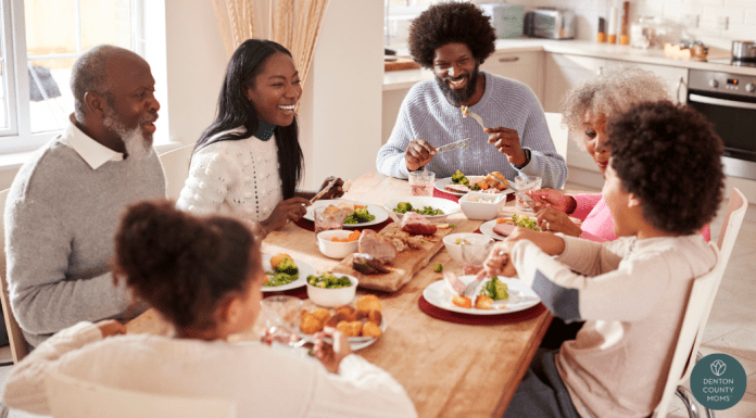Black, multi-generational family eating dinner together